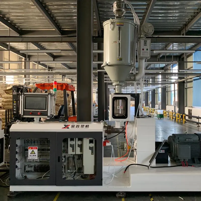 Plastic extruder machine in a factory for continuous profile extrusion