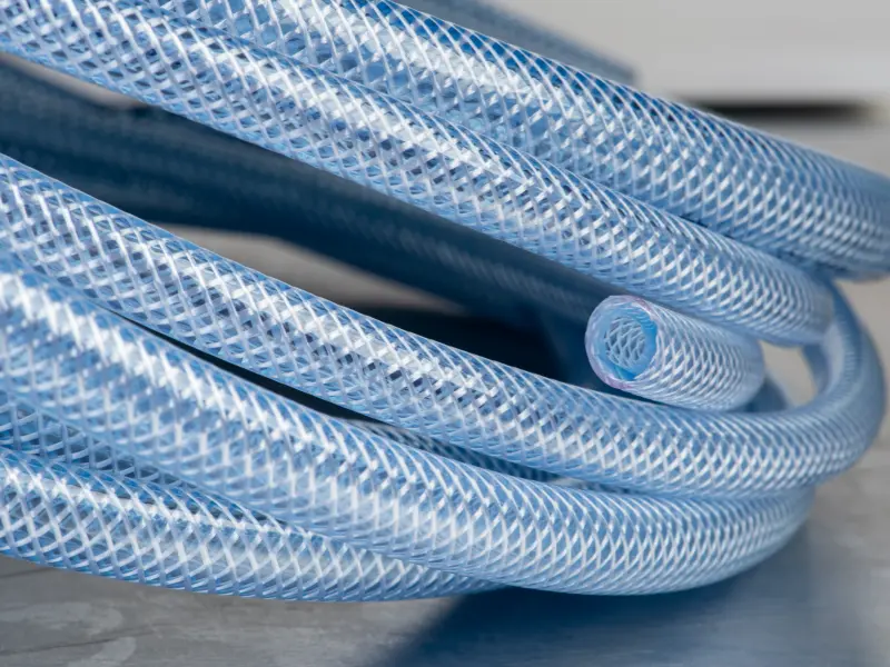 PVC braided hose samples with fiber reinforcement from a PVC braided hose extrusion line