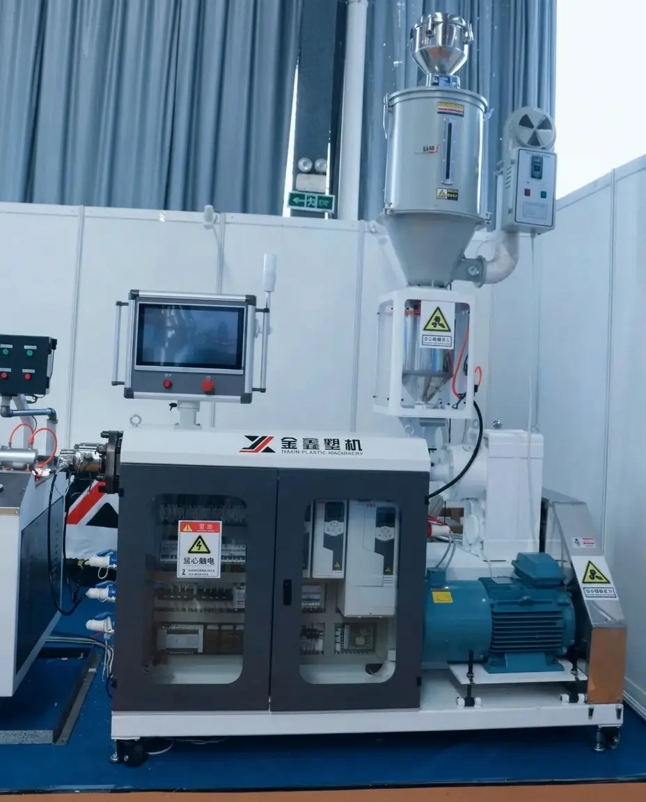 Single screw extruder with parallel motor layout and visible electrical cabinet for custom extrusion line configuration